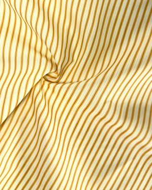 Detalle del tejido de rayas naranja utilizado en el vestido Resort Bloom Naranja